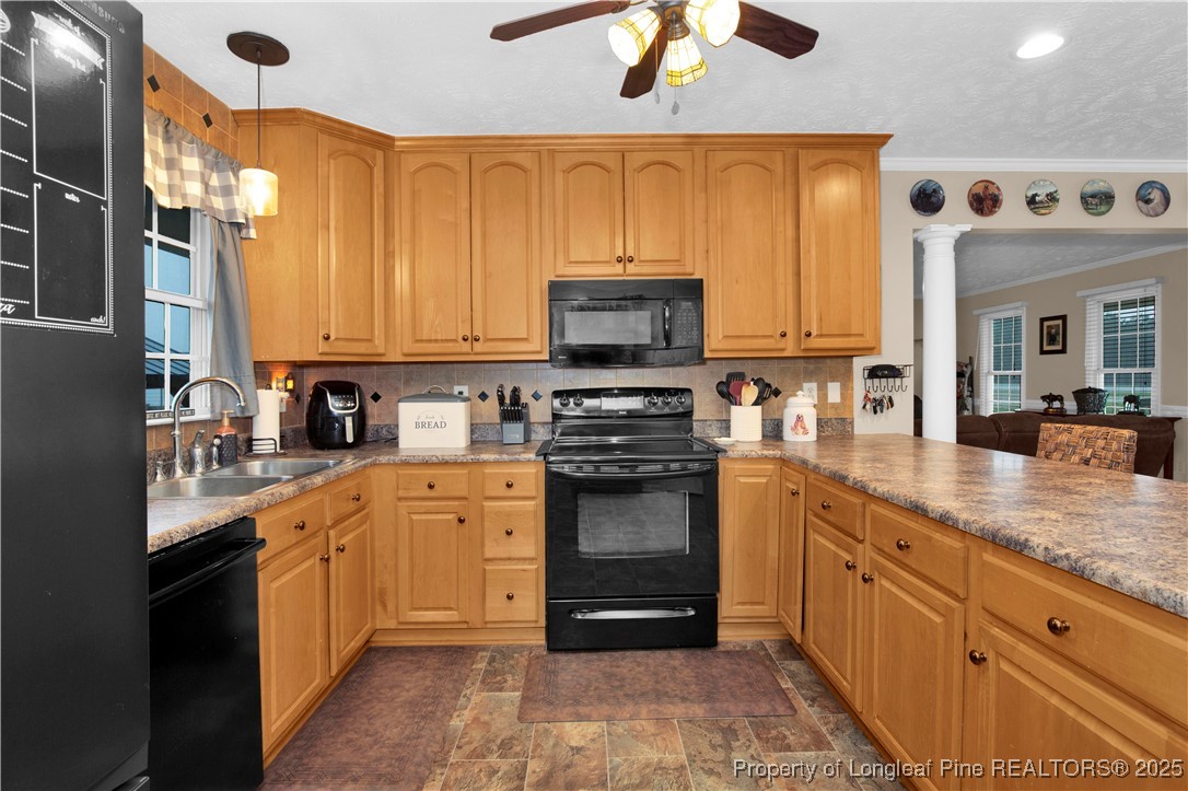 4891 Wade-Stedman Road Wade, NC 28395 - Photo 14 of 46 a kitchen with stainless steel appliances granite countertop a stove a sink and a microwave