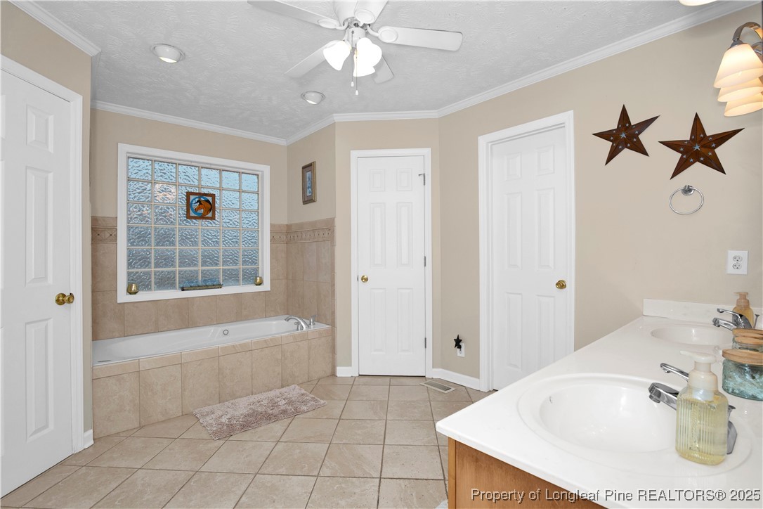 4891 Wade-Stedman Road Wade, NC 28395 - Photo 17 of 46 a bathroom with a bathtub and a shower