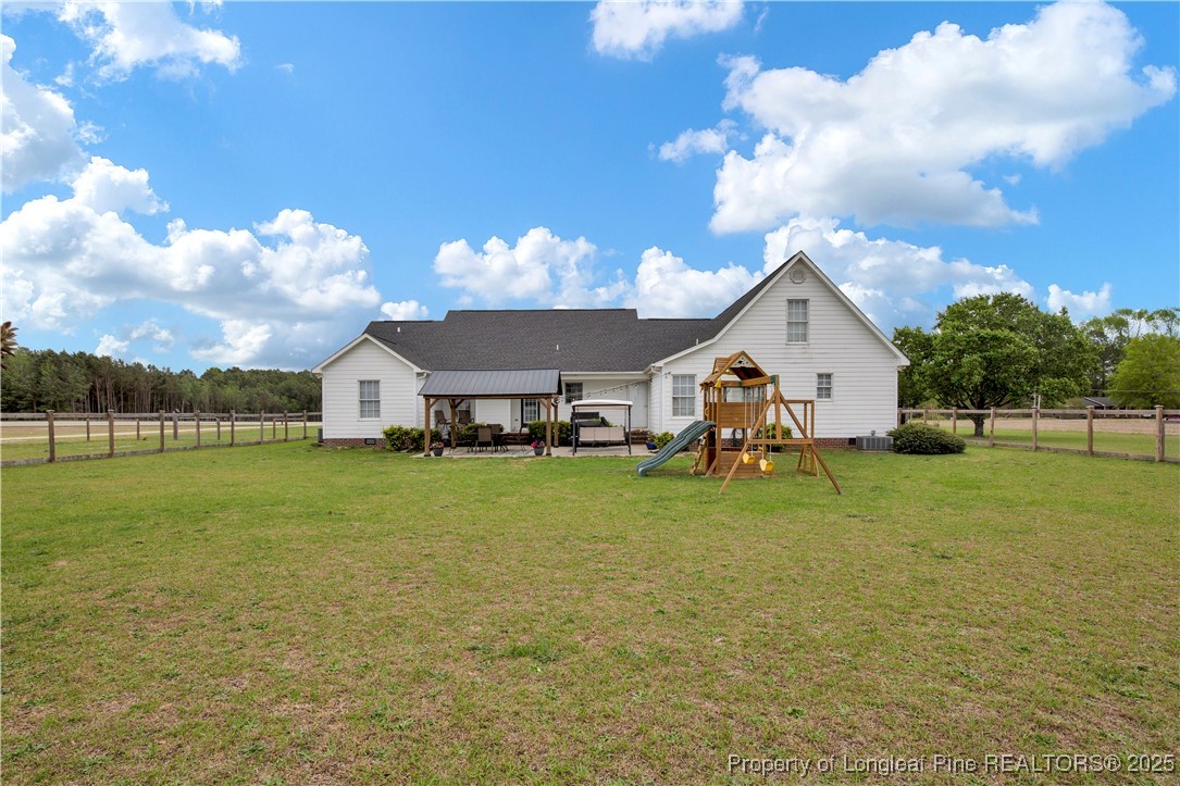 4891 Wade-Stedman Road Wade, NC 28395 - Photo 2 of 46 a view of a house with a yard