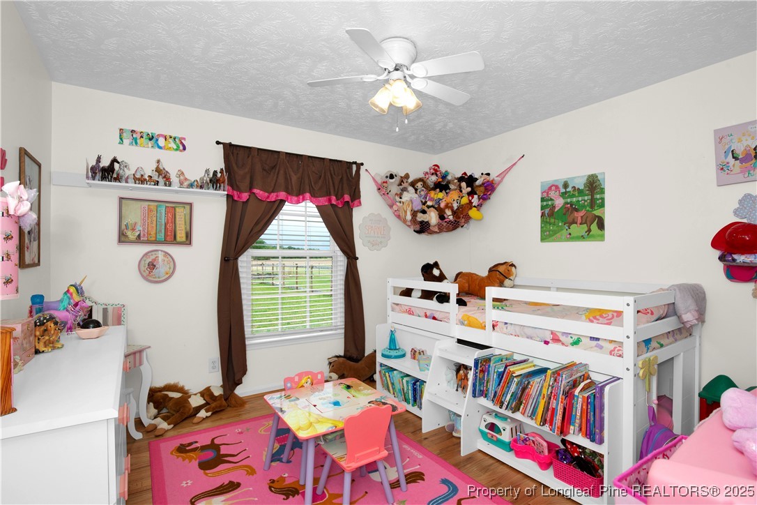 4891 Wade-Stedman Road Wade, NC 28395 - Photo 24 of 46 a bedroom with furniture and a bed