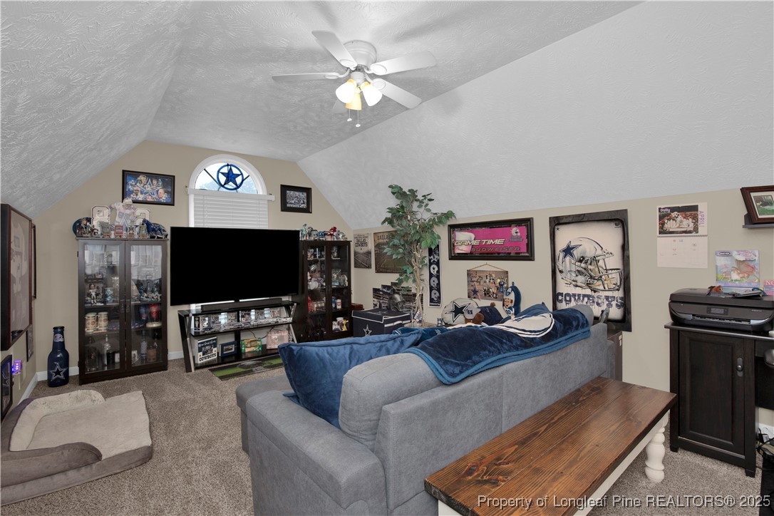 4891 Wade-Stedman Road Wade, NC 28395 - Photo 27 of 46 a living room with furniture and a flat screen tv