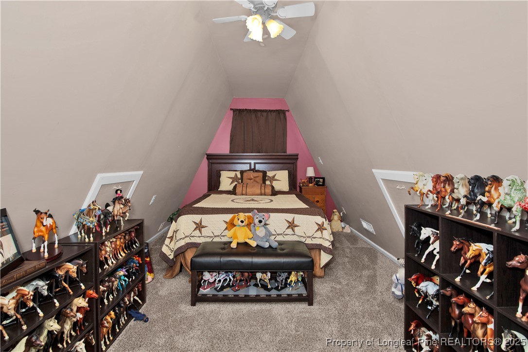 4891 Wade-Stedman Road Wade, NC 28395 - Photo 29 of 46 a bedroom with a bed and a chandelier