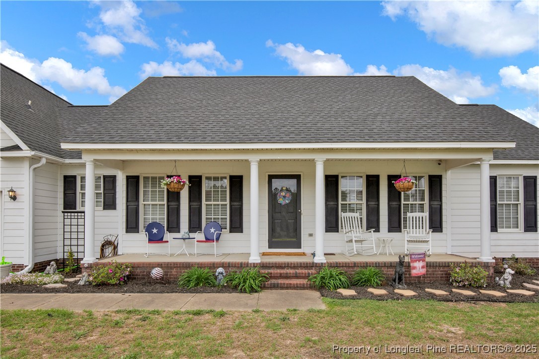 4891 Wade-Stedman Road Wade, NC 28395 - Photo 42 of 46 a front view of a house with a yard