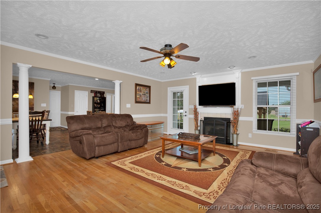 4891 Wade-Stedman Road Wade, NC 28395 - Photo 8 of 46 a living room with furniture and a fireplace