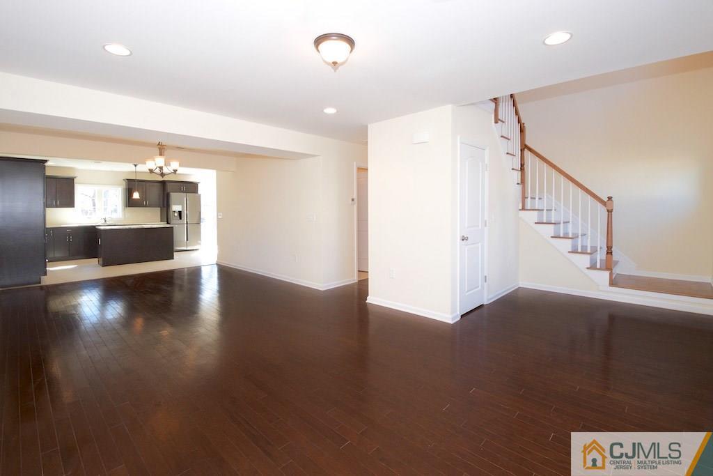 60 Ashley Road Edison, NJ 08817 - Photo 2 of 9 a view of a hallway with wooden floor