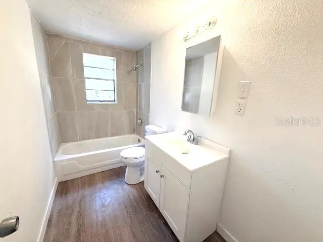 a bathroom with a toilet a sink and a bathtub