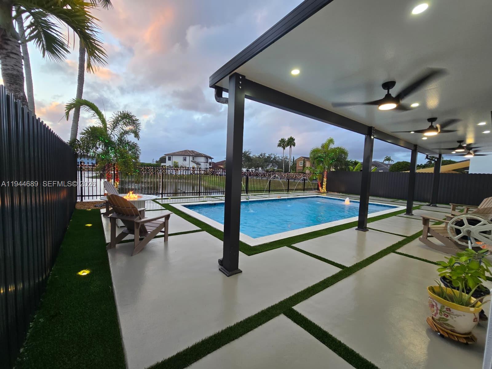 1680 Southwest 154th Path Miami, FL 33185 - Photo 17 of 100 a view of a patio with a table and chairs