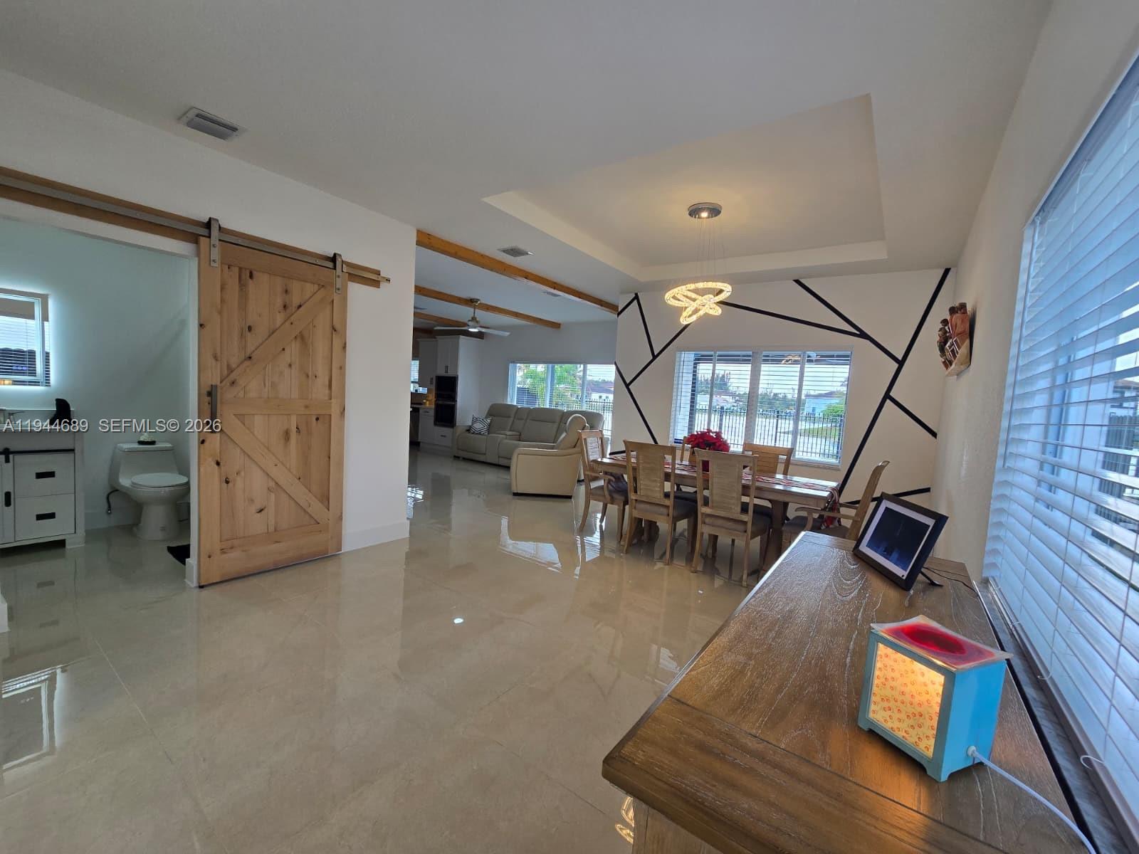 1680 Southwest 154th Path Miami, FL 33185 - Photo 25 of 100 a view of a livingroom with furniture and a ceiling fan