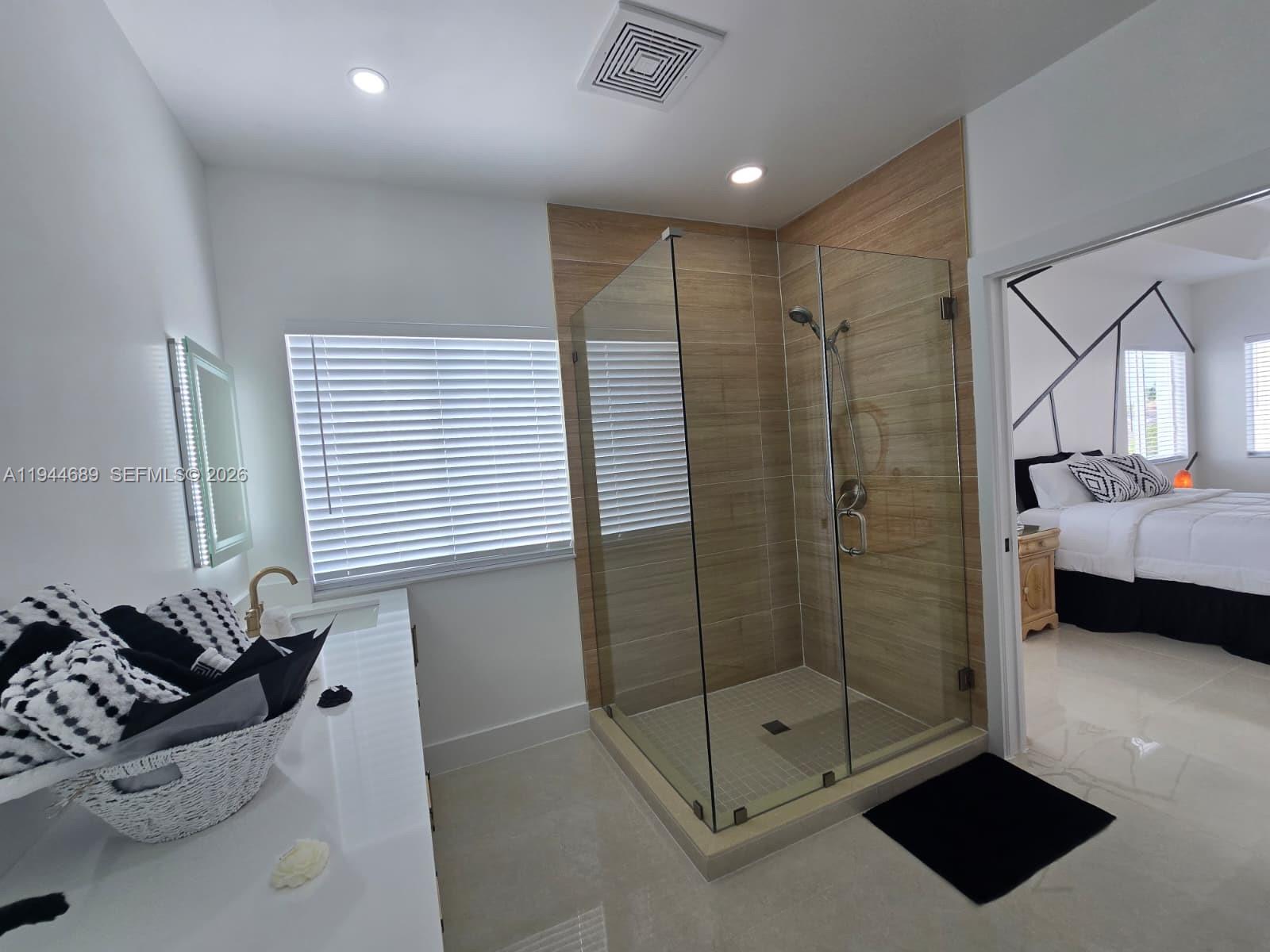 1680 Southwest 154th Path Miami, FL 33185 - Photo 7 of 100 a bathroom with a shower