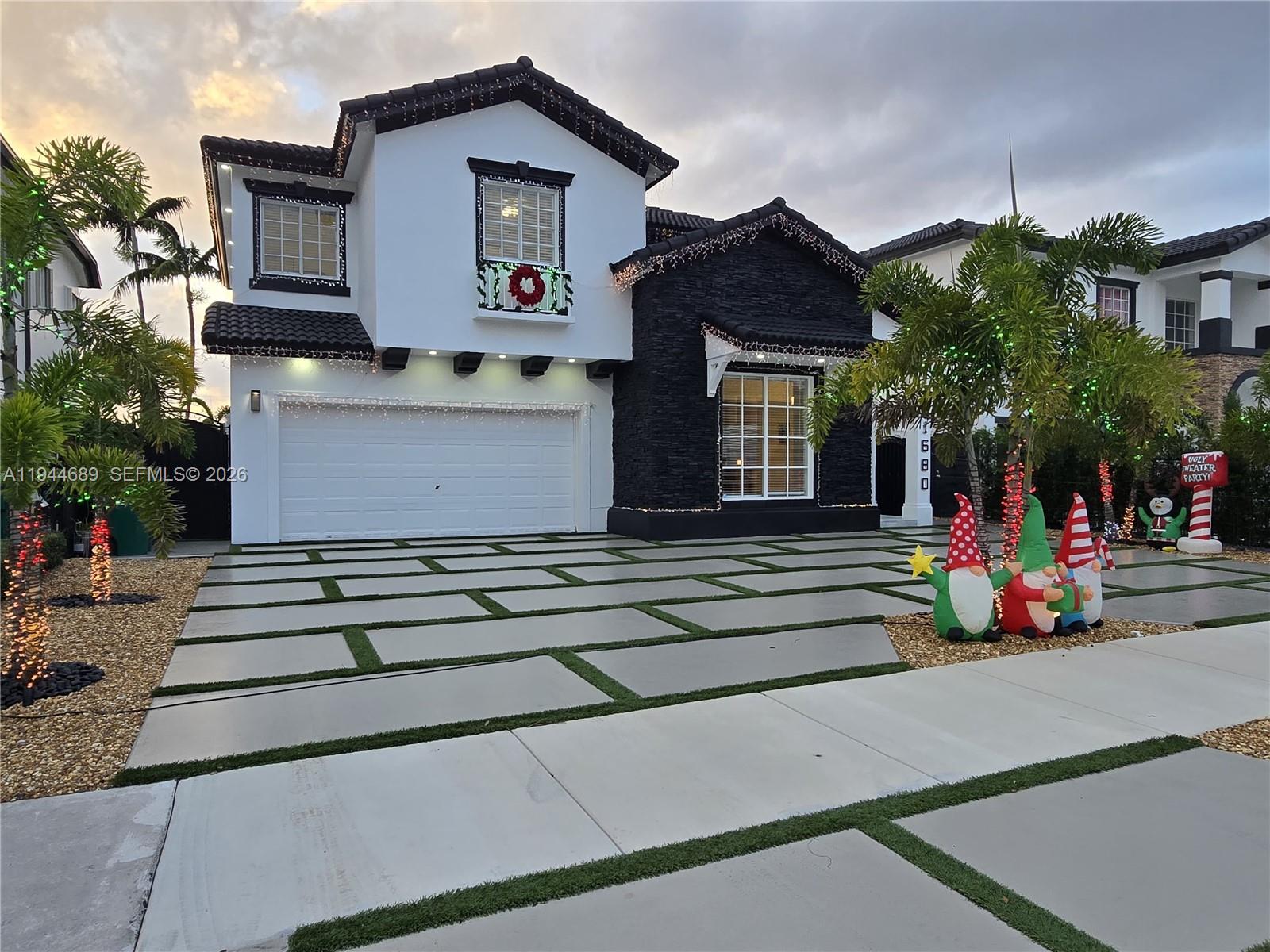 1680 Southwest 154th Path Miami, FL 33185 - Photo 94 of 100 a front view of a house with a yard
