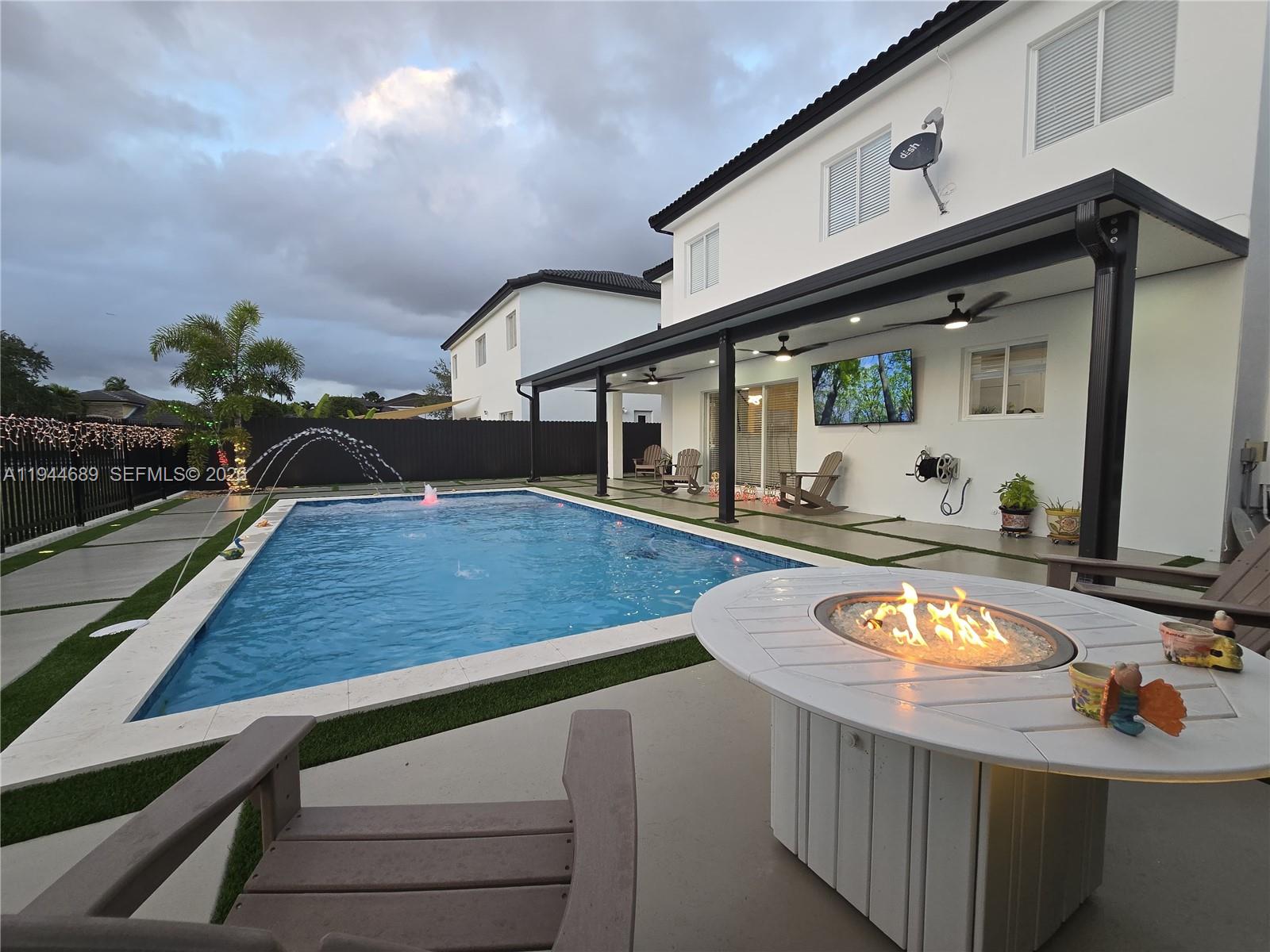 1680 Southwest 154th Path Miami, FL 33185 - Photo 97 of 100 a view of a living room and dining room