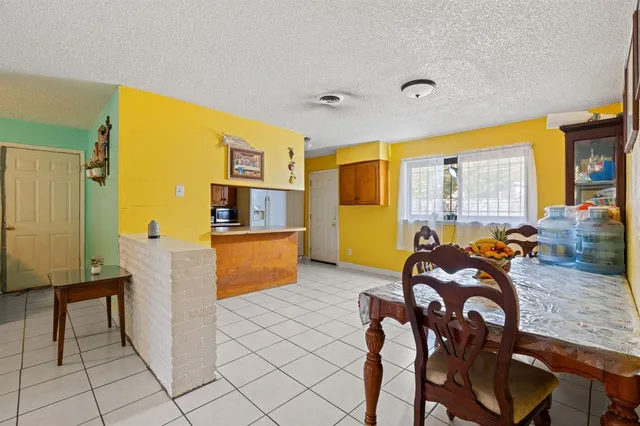 a view of a livingroom with furniture and a window