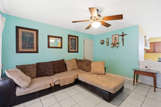 a living room with furniture and a window