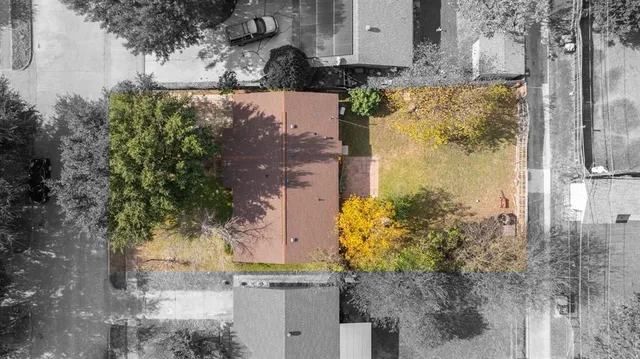 a aerial view of a house with a yard