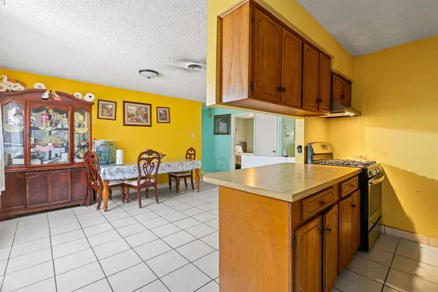 a utility room with multiple dryer and washer