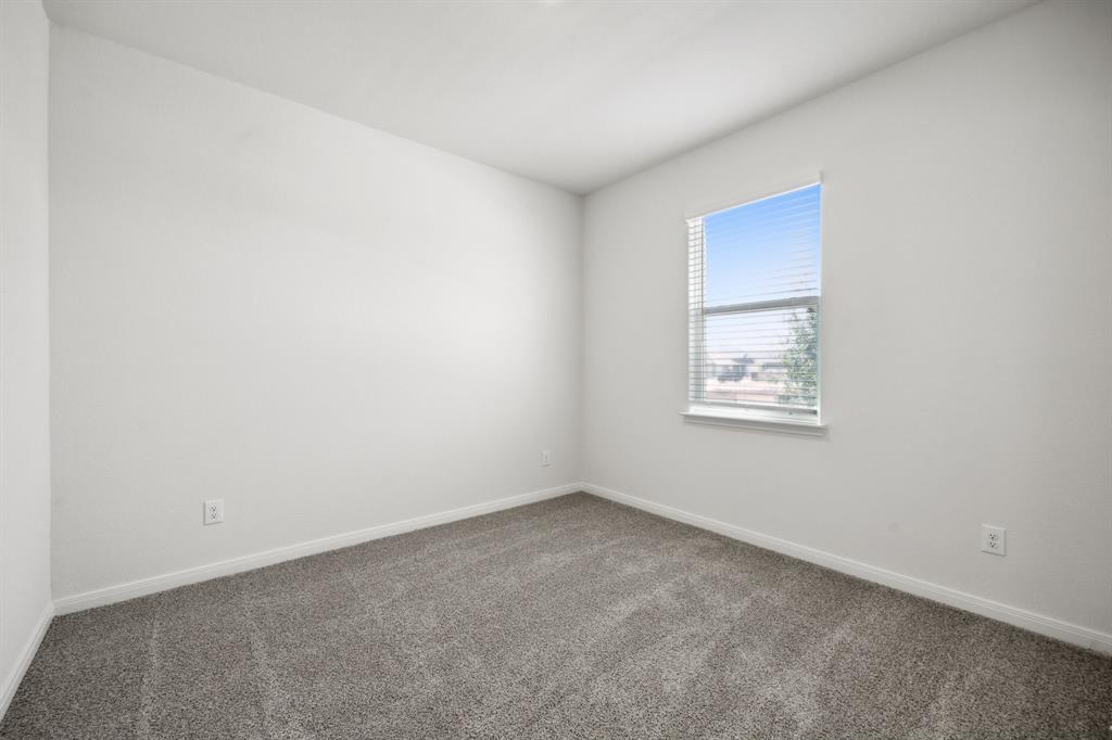 9908 Fighting Falcon Way Fort Worth, TX 76131 - Photo 4 of 22 an empty room with a window