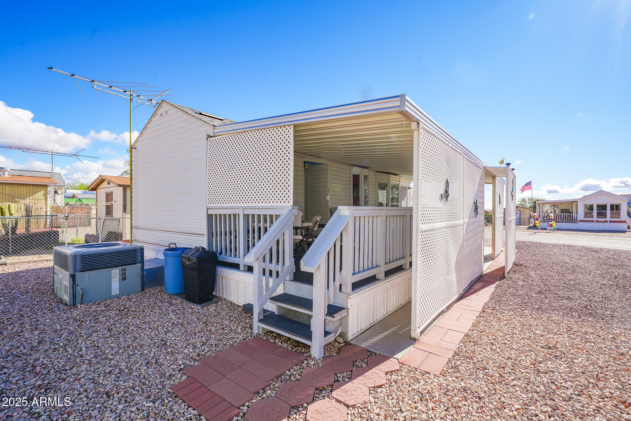 21282 Escapees Way, Unit 409 Congress, AZ 85332 - Photo 16 of 33 a view of a house with backyard and porch