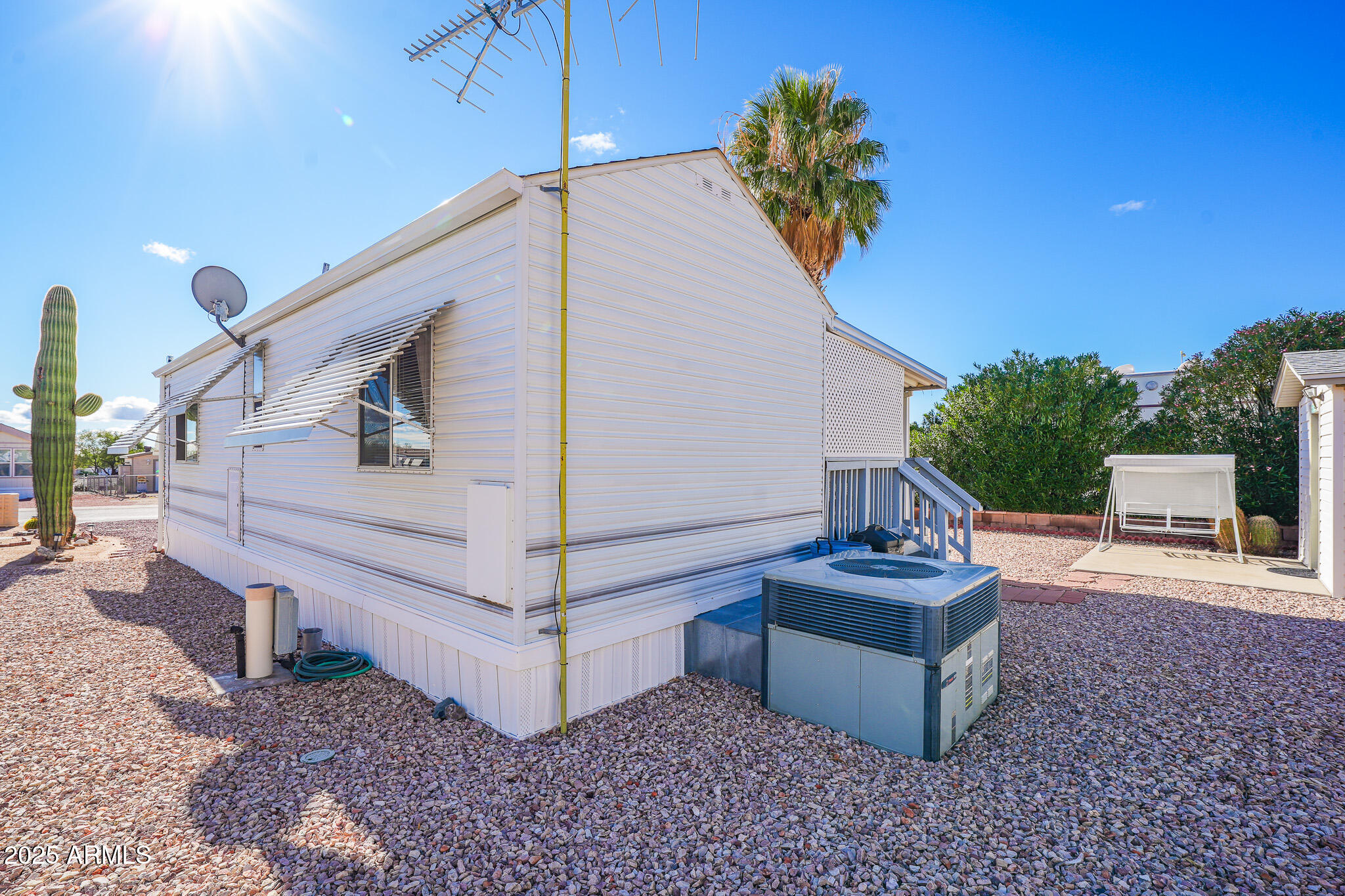 21282 Escapees Way, Unit 409 Congress, AZ 85332 - Photo 22 of 33 a view of a couches in patio and the backyard of a house