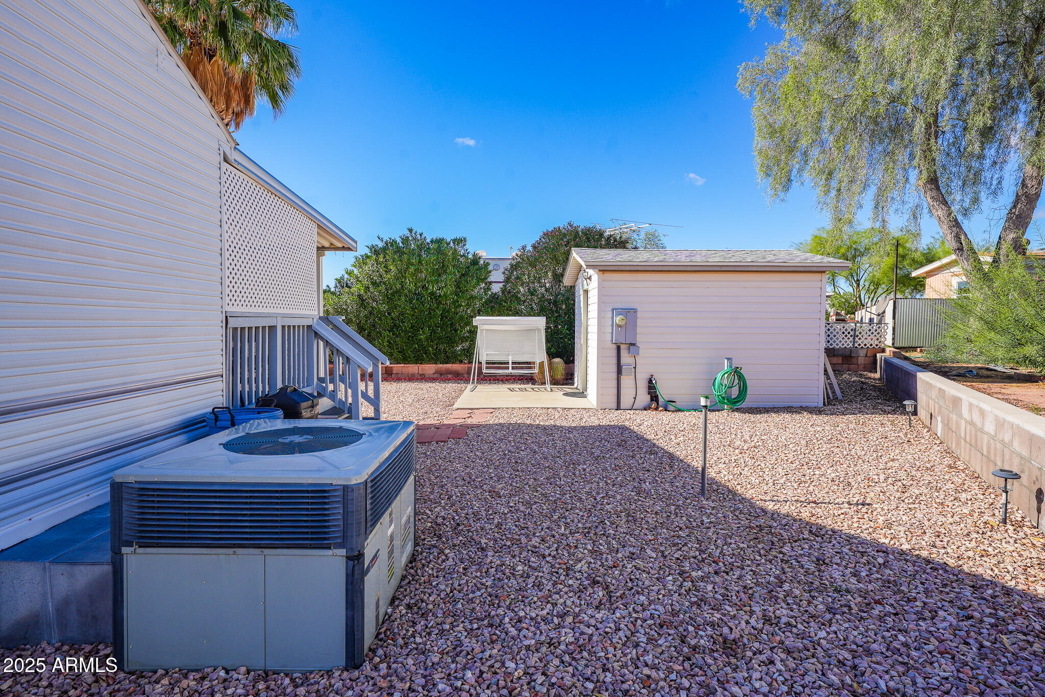 21282 Escapees Way, Unit 409 Congress, AZ 85332 - Photo 23 of 33 a front view of a house with garden