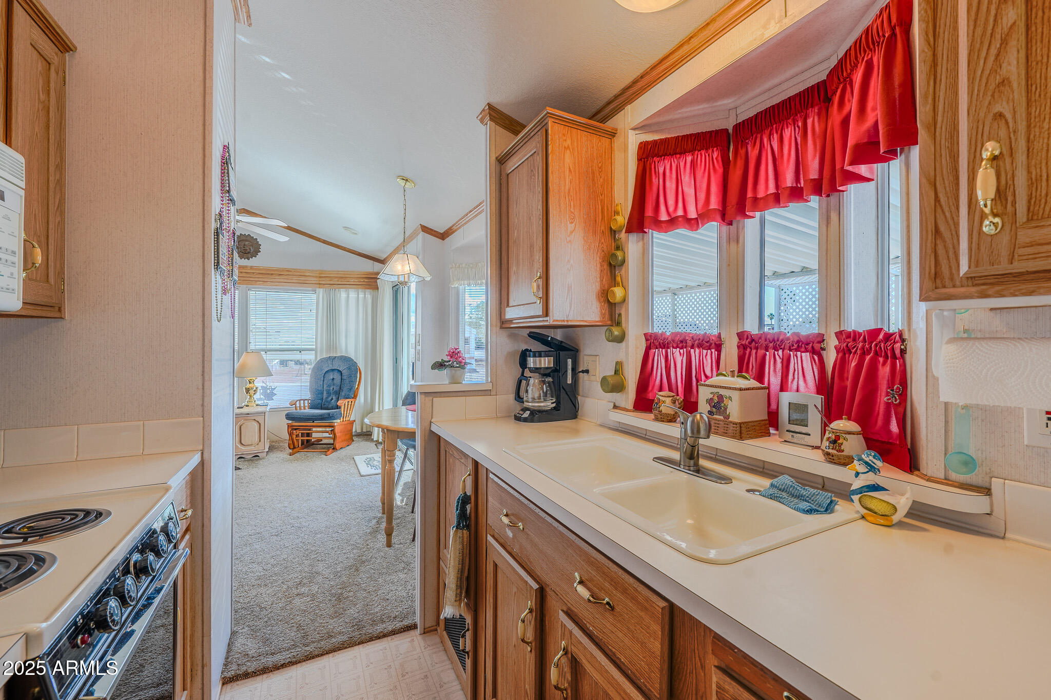 21282 Escapees Way, Unit 409 Congress, AZ 85332 - Photo 8 of 33 a view of kitchen sink and natural light