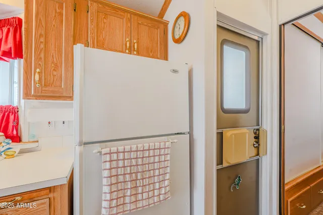 a bathroom with a granite countertop shower and a toilet