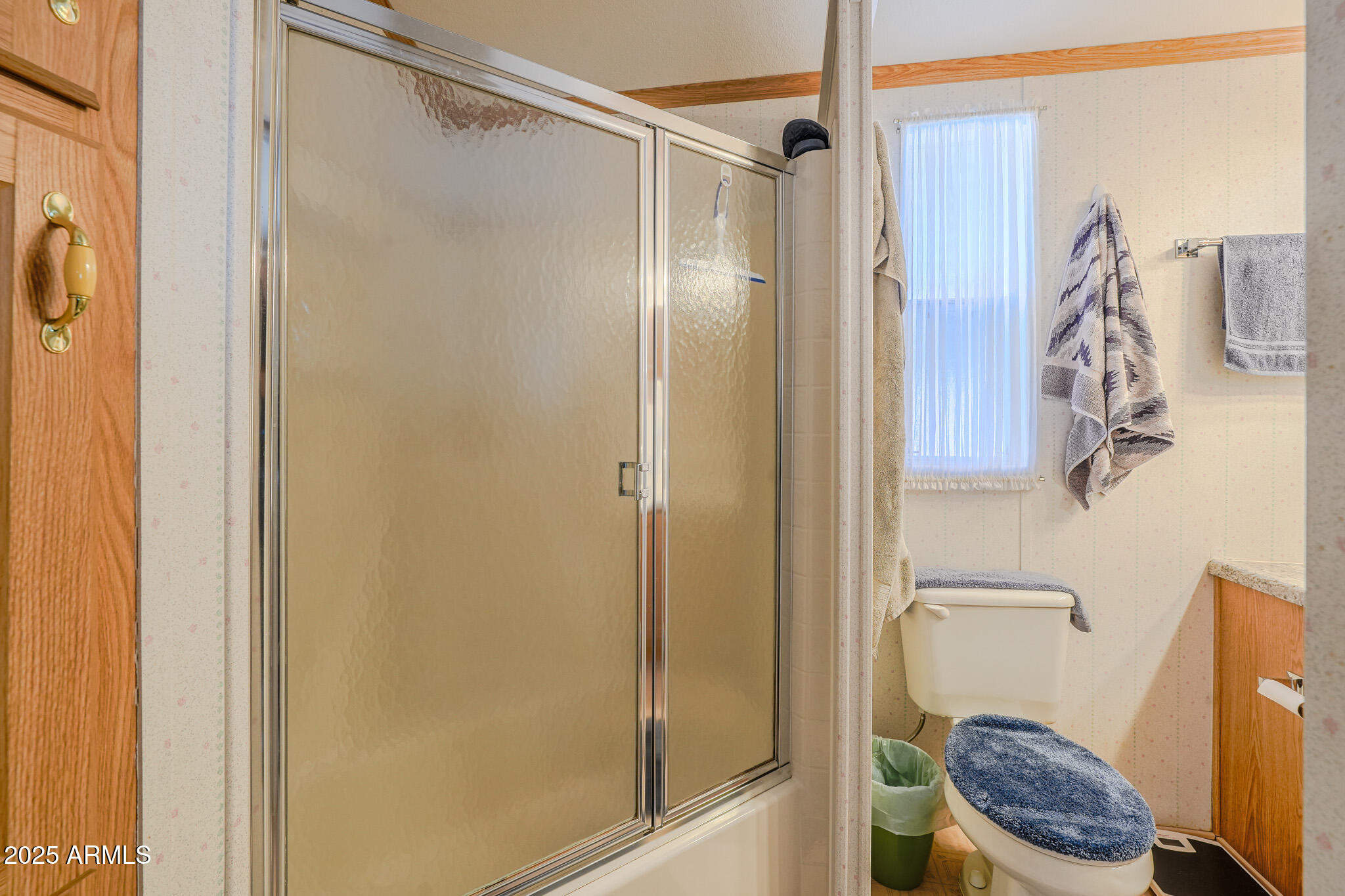 21282 Escapees Way, Unit 409 Congress, AZ 85332 - Photo 10 of 33 a bathroom with a granite countertop shower and a toilet