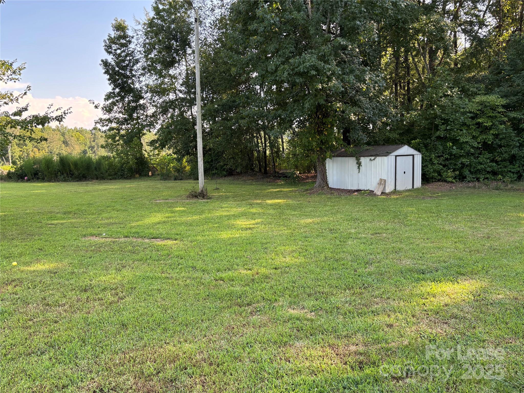 994 Wilma Sigmon Road Lincolnton, NC 28092 - Photo 15 of 15 a house with a trees in the background