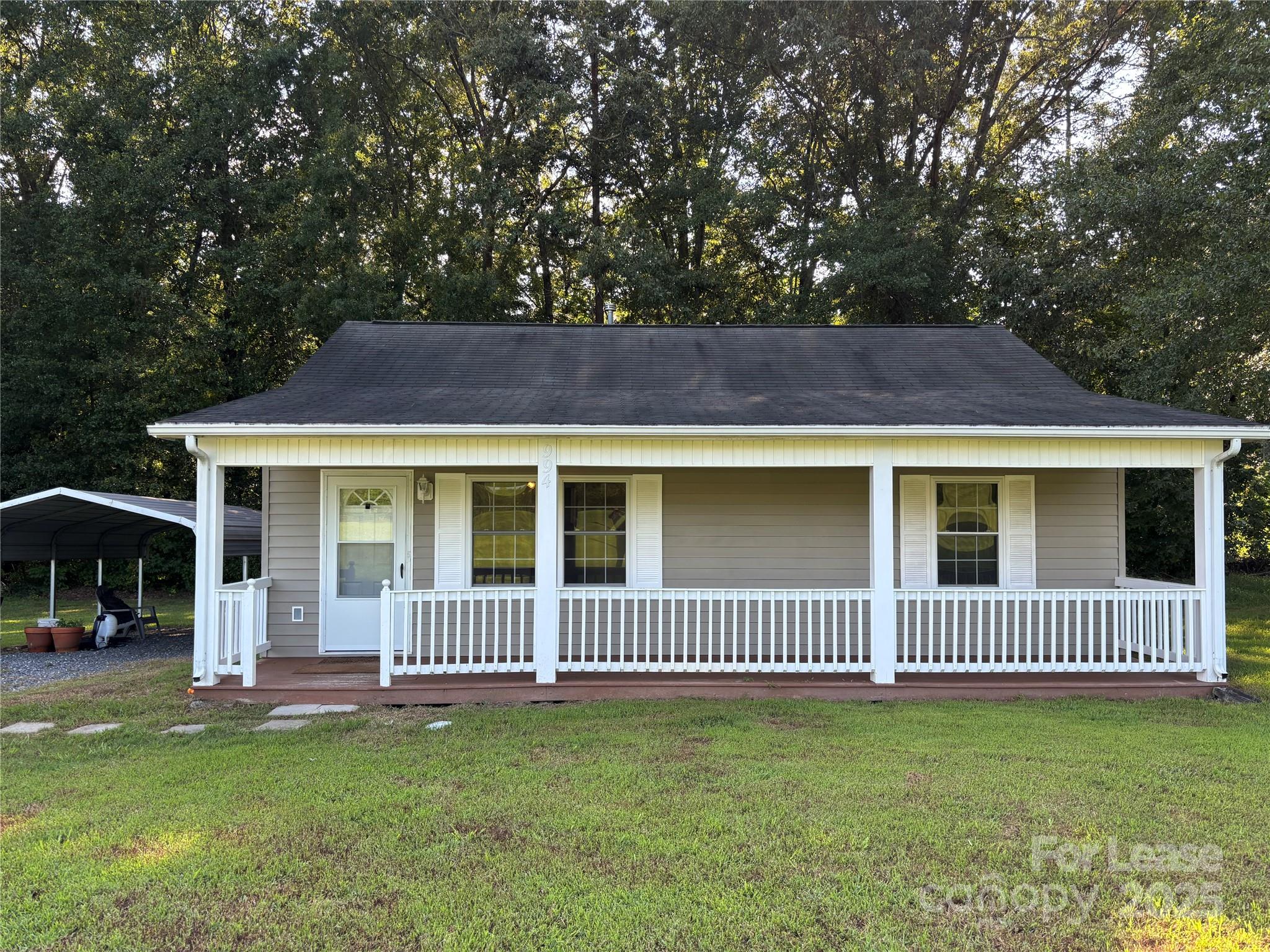 994 Wilma Sigmon Road Lincolnton, NC 28092 - Photo 2 of 15 a view of a house with a yard and a deck