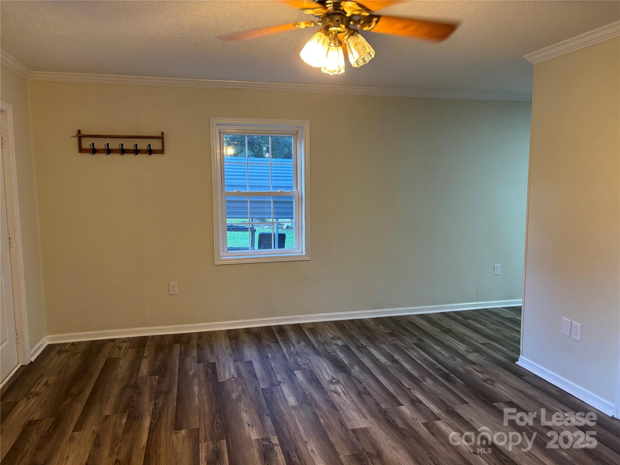 994 Wilma Sigmon Road Lincolnton, NC 28092 - Photo 6 of 15 a view of an empty room with wooden floor and a window