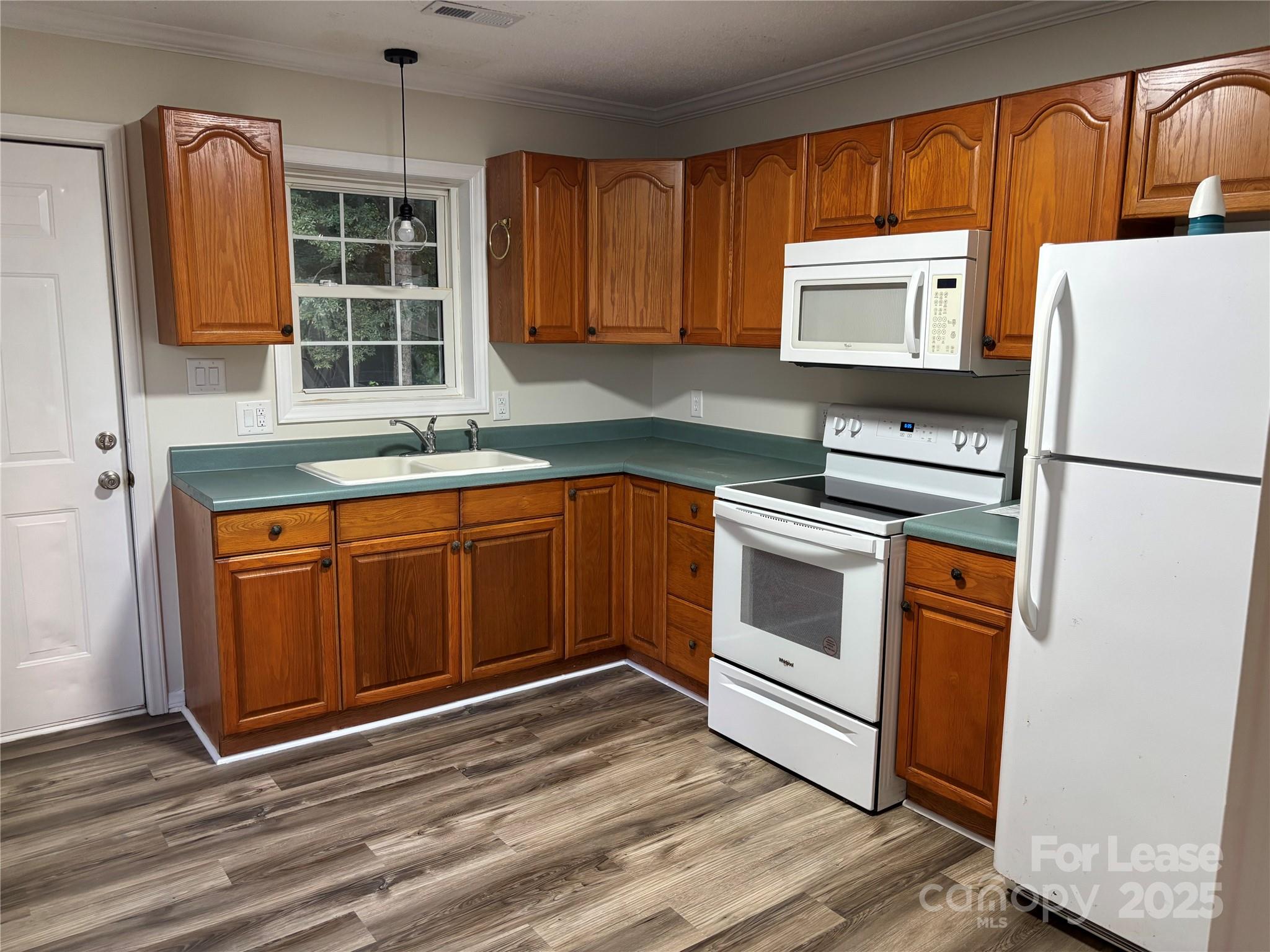 994 Wilma Sigmon Road Lincolnton, NC 28092 - Photo 7 of 15 a kitchen with stainless steel appliances granite countertop a refrigerator sink and cabinets