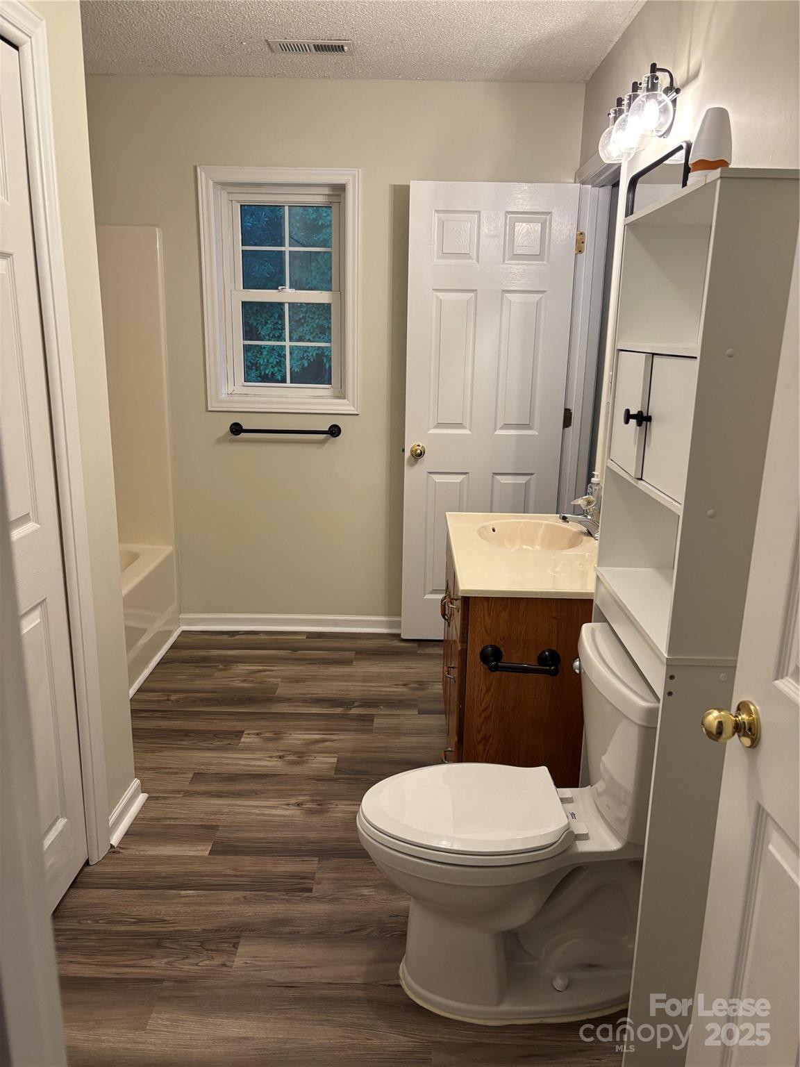 994 Wilma Sigmon Road Lincolnton, NC 28092 - Photo 10 of 15 a white toilet sitting next to a bathroom sink
