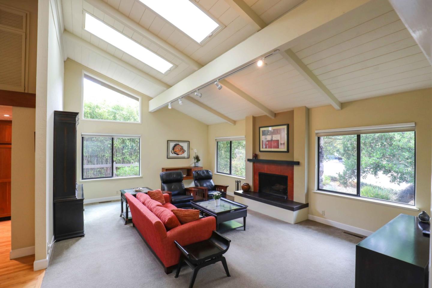 16 Westwood Road Santa Cruz, CA 95060 - Photo 15 of 46 a living room with furniture a fireplace and a large window