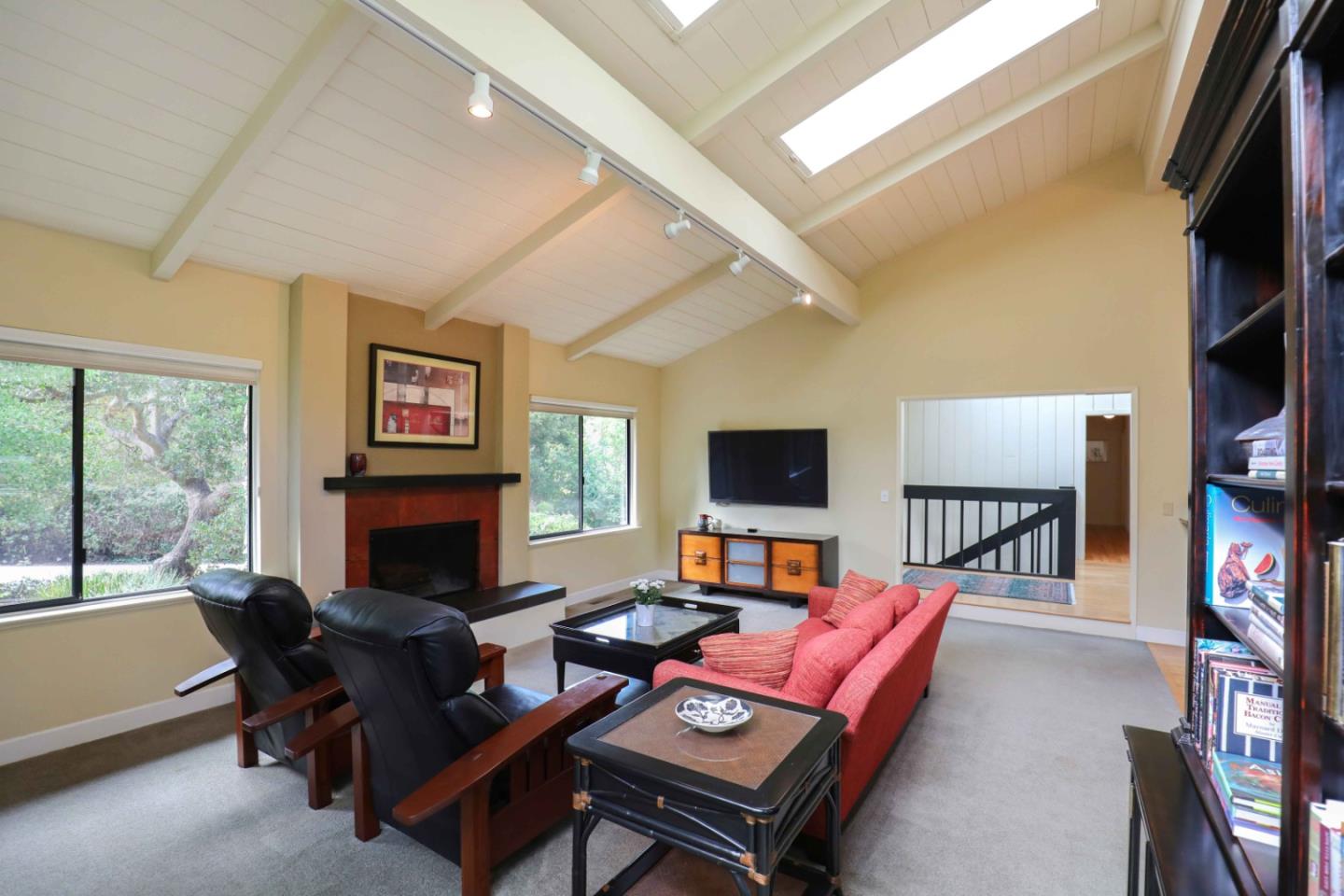 16 Westwood Road Santa Cruz, CA 95060 - Photo 17 of 46 a living room with furniture a flat screen tv and a fireplace