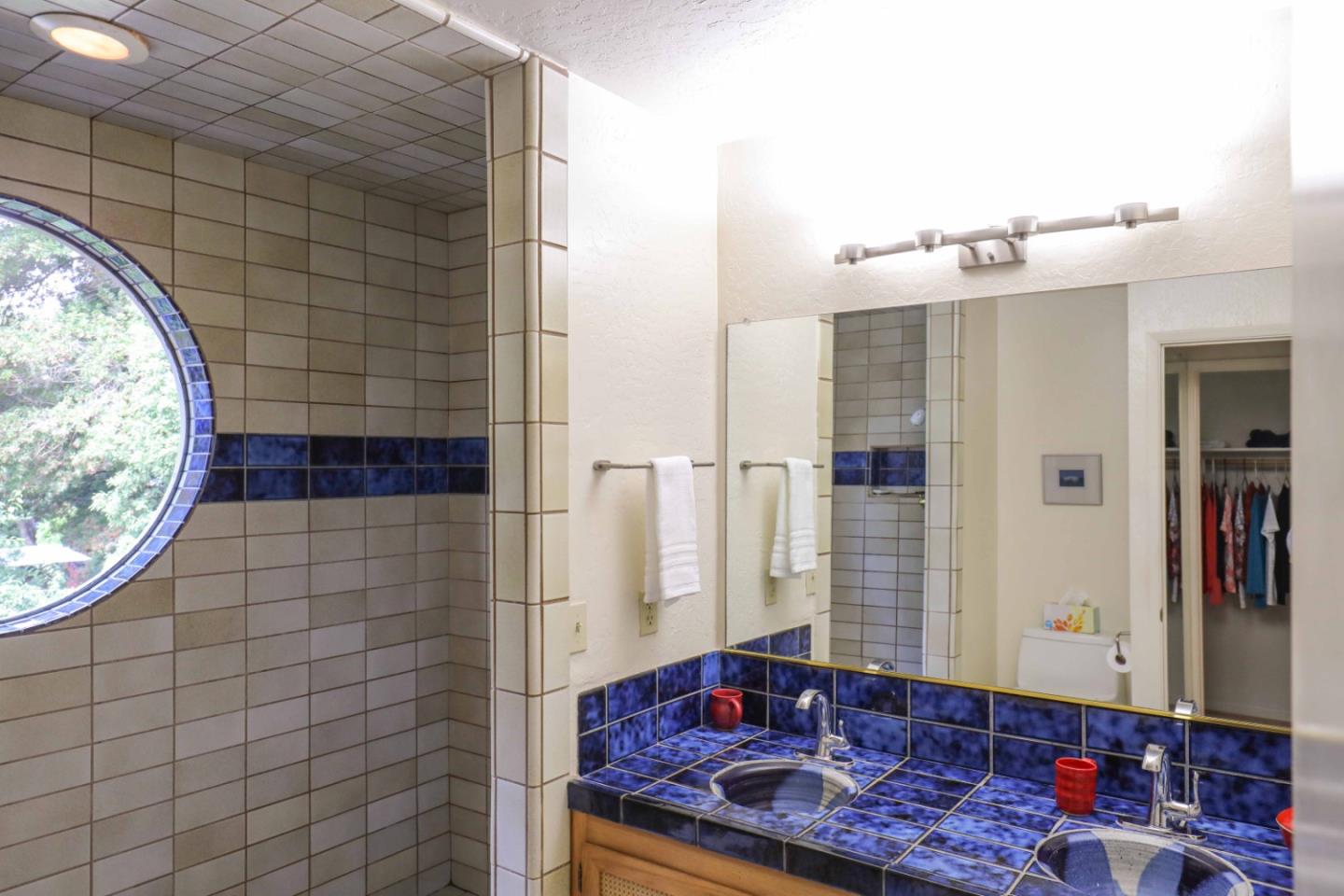 16 Westwood Road Santa Cruz, CA 95060 - Photo 31 of 46 a bathroom with a glass door shower and a sink