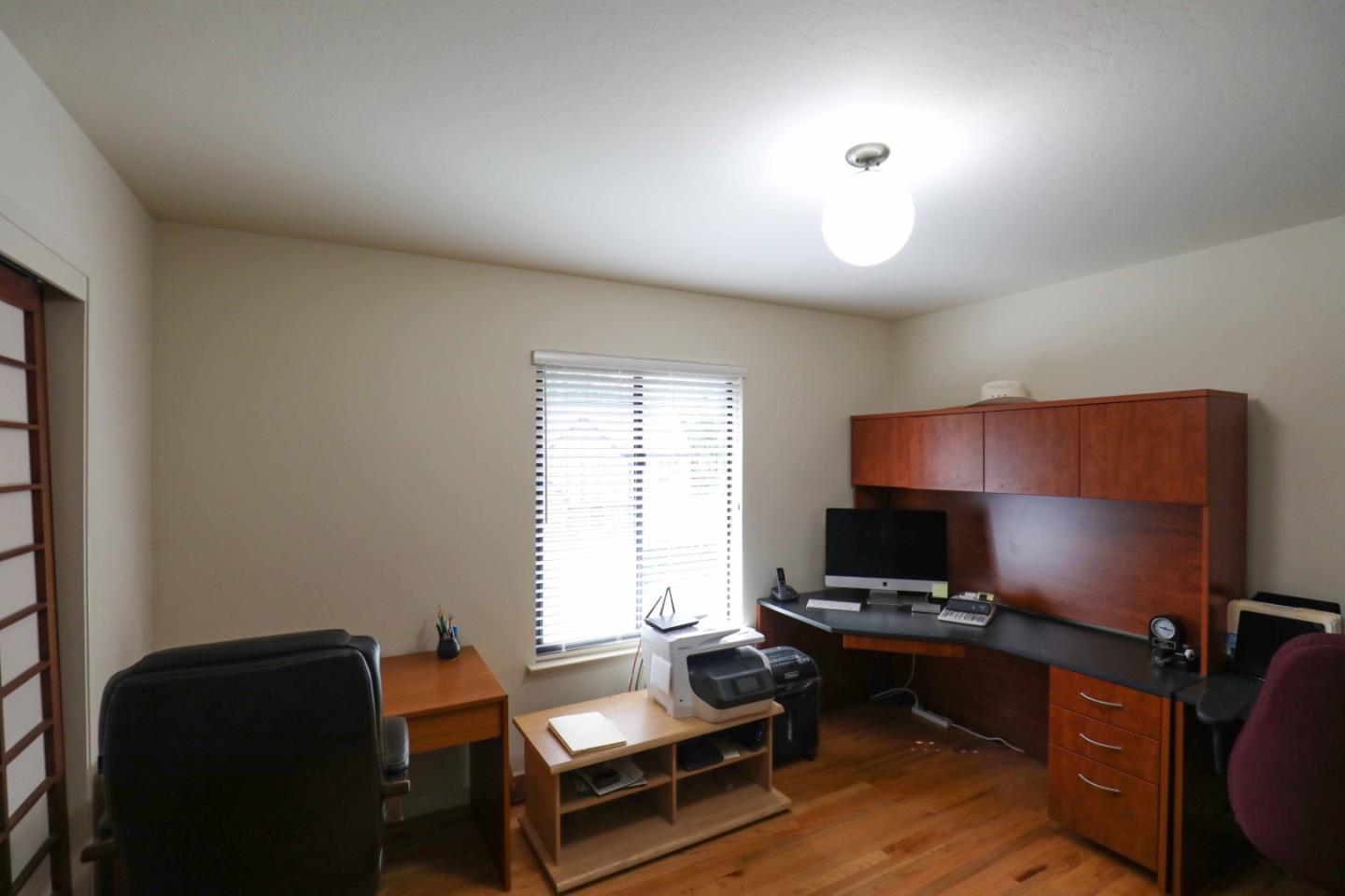 16 Westwood Road Santa Cruz, CA 95060 - Photo 32 of 46 a livingroom with workspace and a window