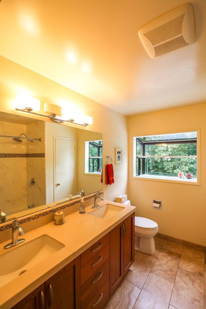 16 Westwood Road Santa Cruz, CA 95060 - Photo 34 of 46 a bathroom with a toilet sink and mirror