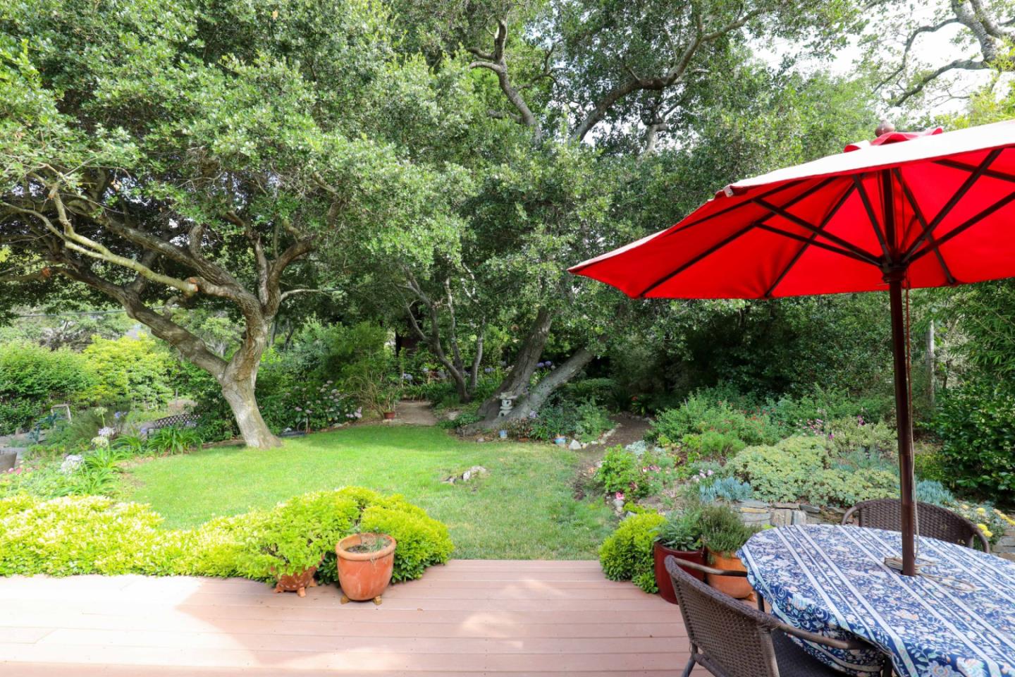 16 Westwood Road Santa Cruz, CA 95060 - Photo 42 of 46 a backyard of a house with a yard and outdoor seating