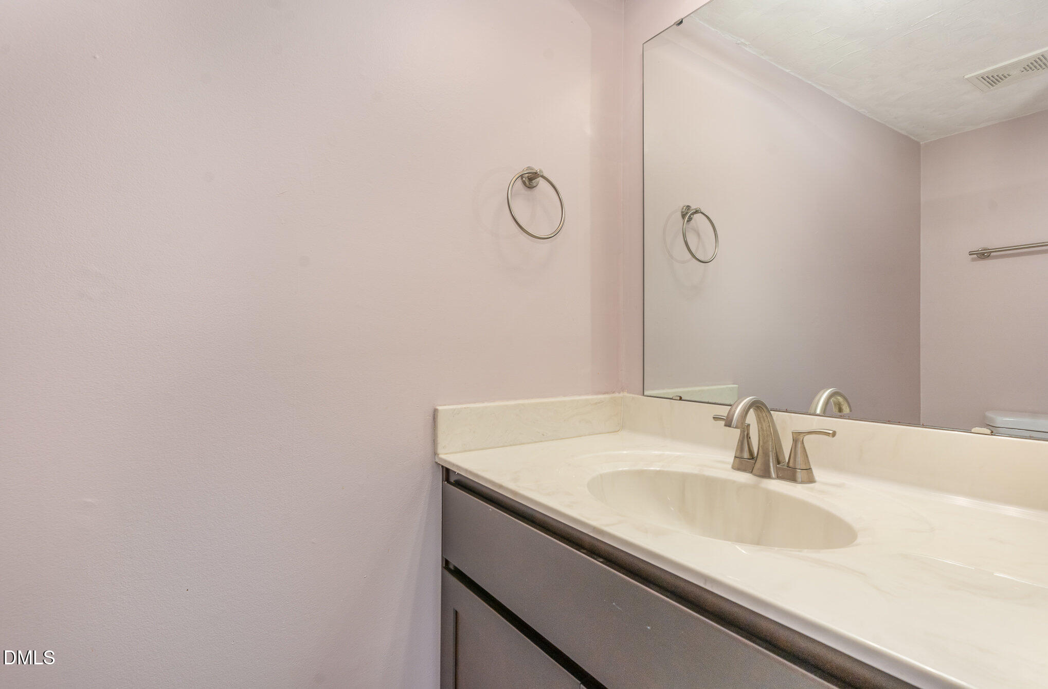 1304 Seaton Road, Unit 1 Durham, NC 27713 - Photo 8 of 20 a bathroom with a sink and a mirror