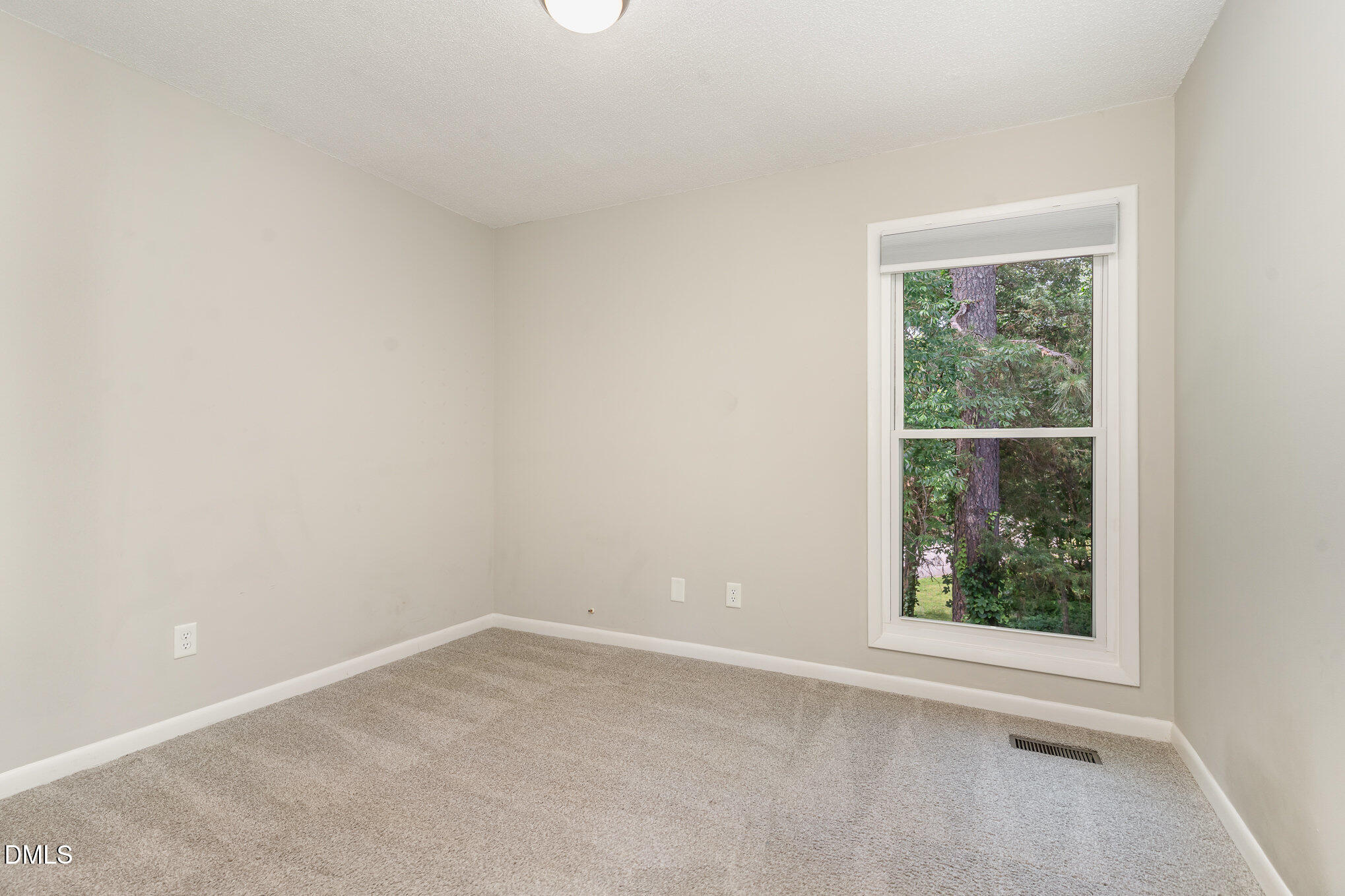 1304 Seaton Road, Unit 1 Durham, NC 27713 - Photo 13 of 20 an empty room with a window