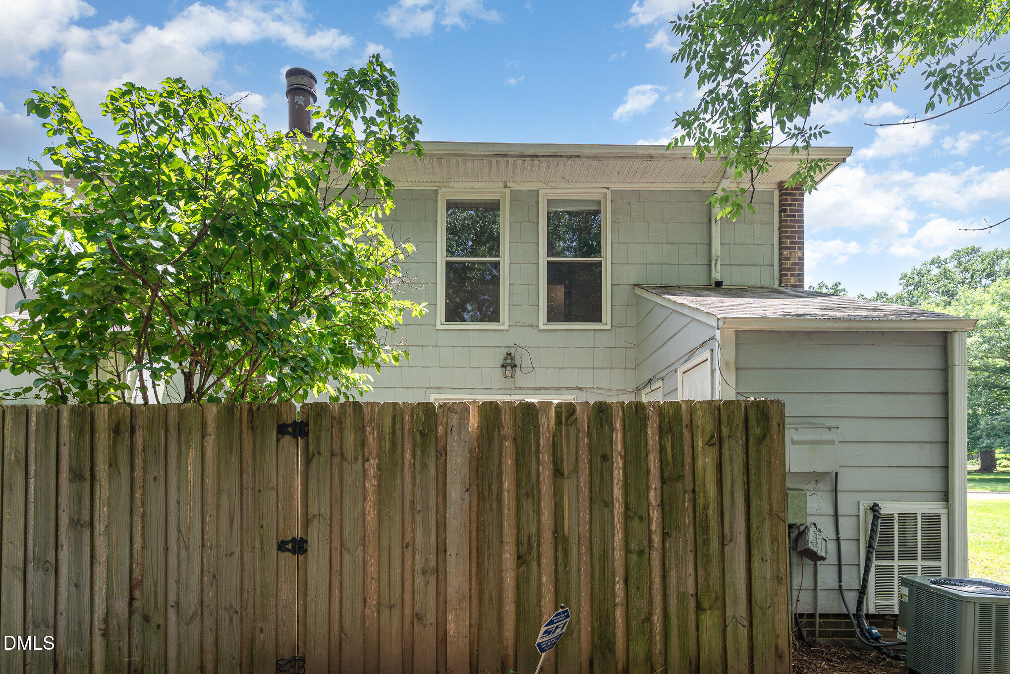 1304 Seaton Road, Unit 1 Durham, NC 27713 - Photo 16 of 20 a front view of a house with a tree