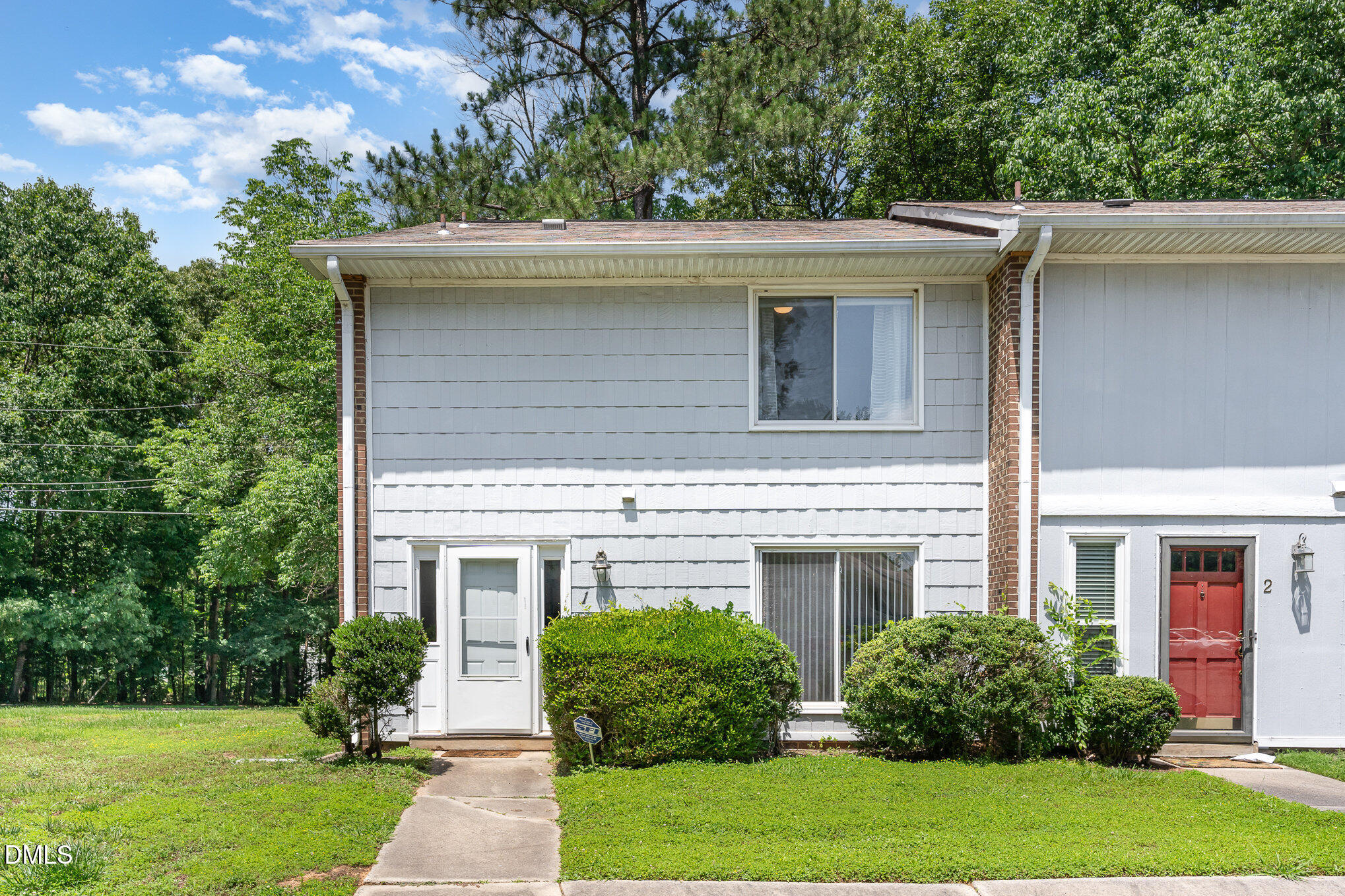 1304 Seaton Road, Unit 1 Durham, NC 27713 - Photo 2 of 20 front view of a house with a yard