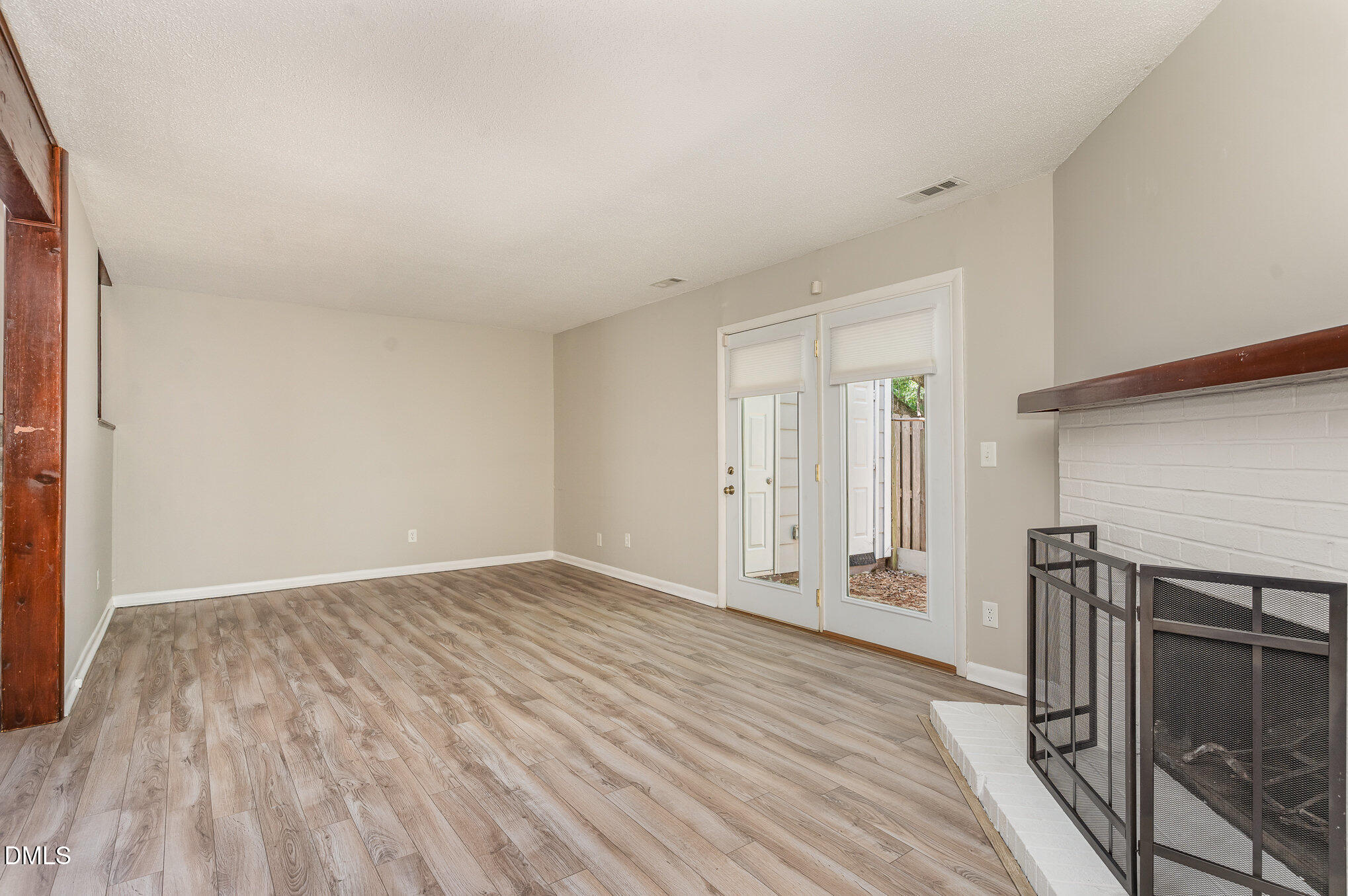 1304 Seaton Road, Unit 1 Durham, NC 27713 - Photo 4 of 20 a view of an empty room with wooden floor and entryway