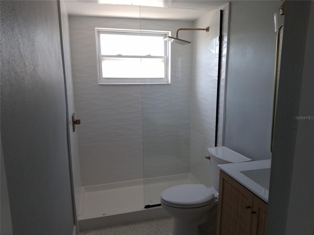 11355 3rd Street East Treasure Island, FL 33706 - Photo 16 of 19 a bathroom with a shower and a toilet