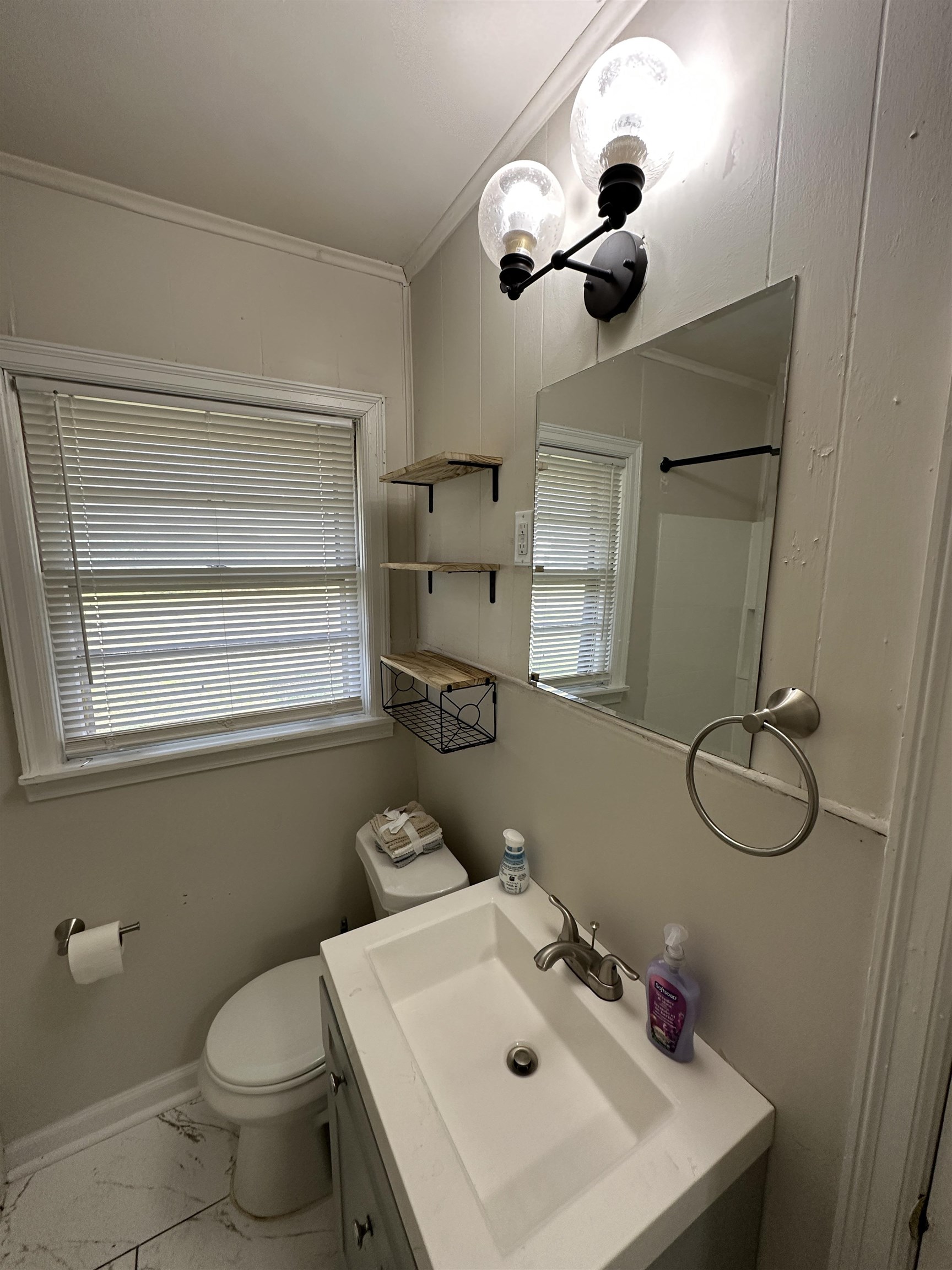 470 Dreger Road Memphis, TN 38109 - Photo 11 of 19 Full bathroom with vanity, light marble finish floors, a shower, and crown molding