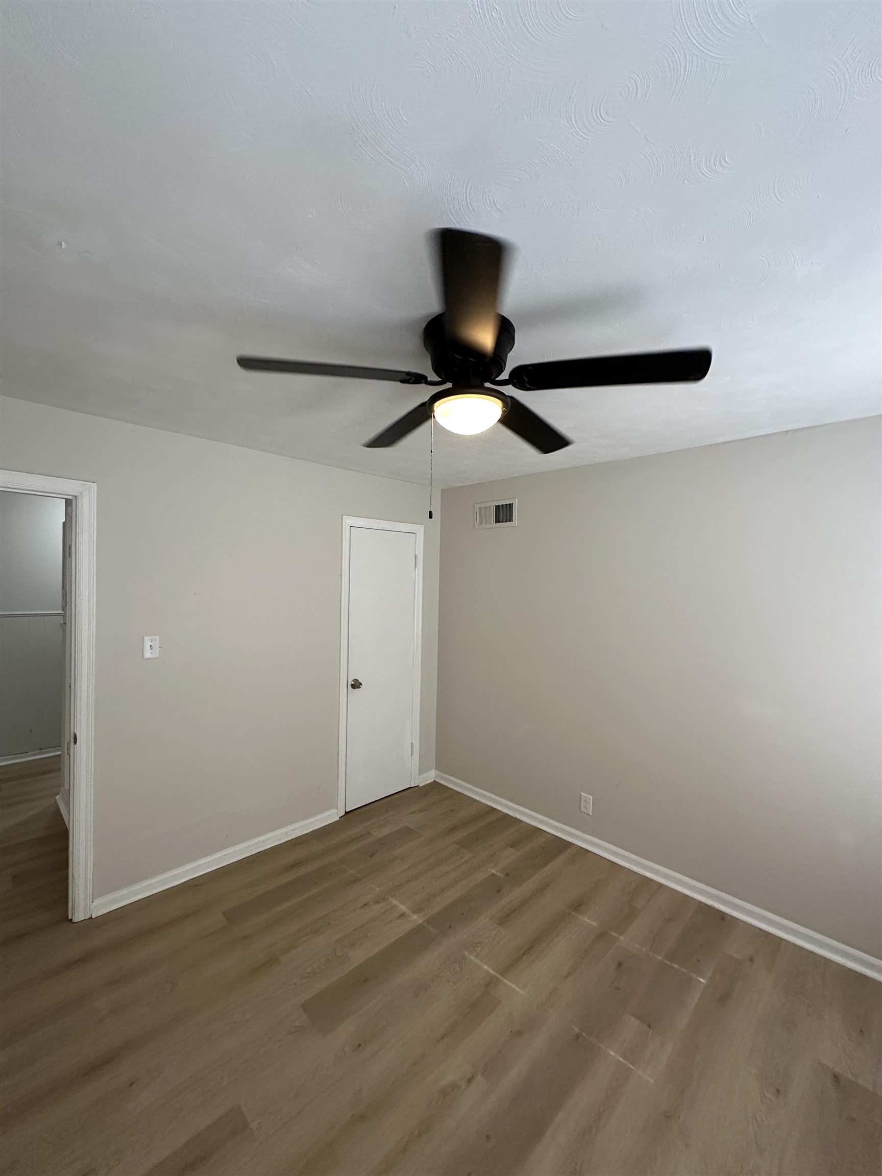 470 Dreger Road Memphis, TN 38109 - Photo 18 of 19 Unfurnished bedroom with wood finished floors and a ceiling fan