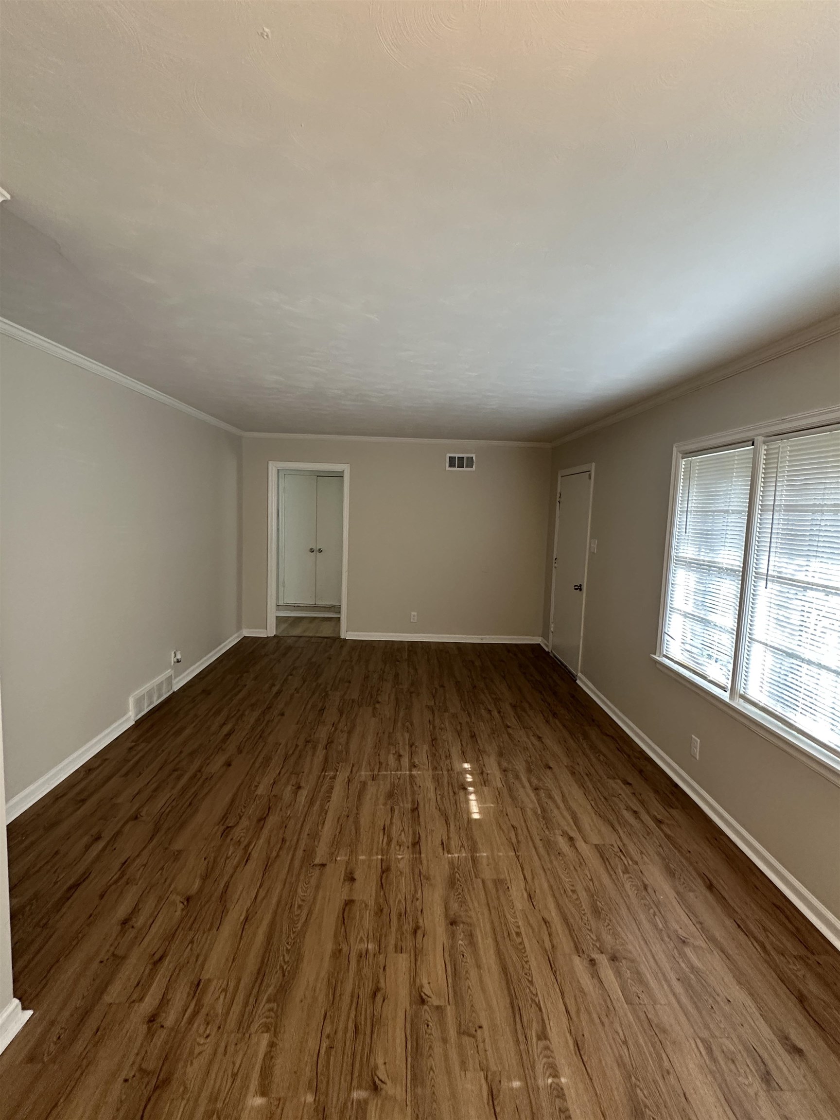 470 Dreger Road Memphis, TN 38109 - Photo 2 of 19 Unfurnished room featuring wood finished floors and crown molding