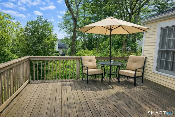 a view of a chairs on wooden deck