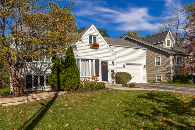 a front view of a house with yard and seating area