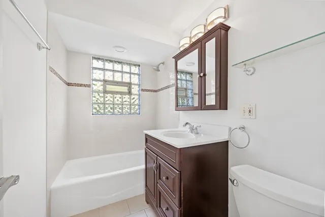 a bathroom with a sink a toilet and a bathtub