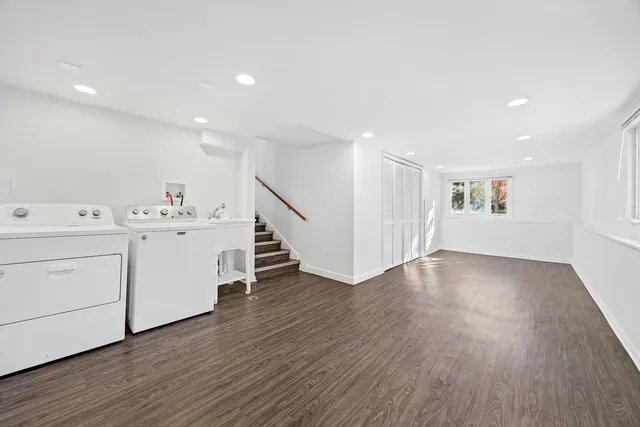 a view of utility room with wooden floor